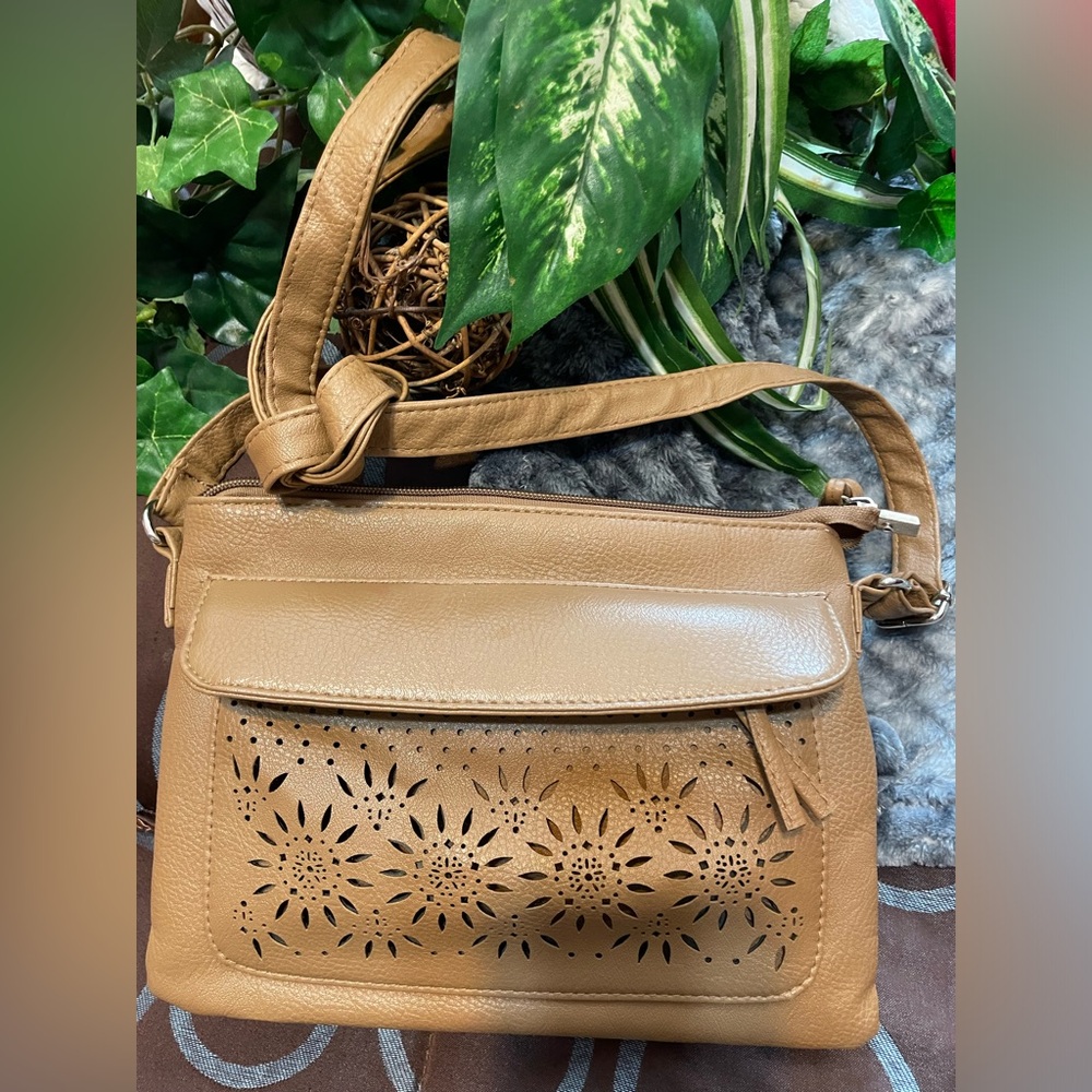 Tan small crossbody leather purse Has long shoulder strap 2 outside zip storage